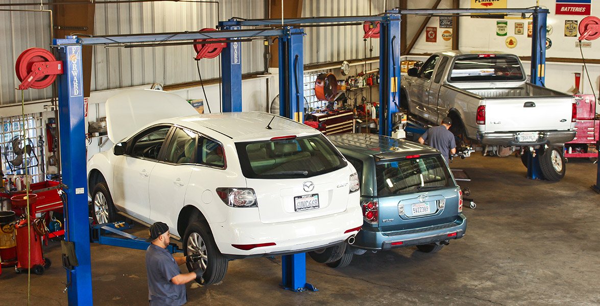 Ray Frey shop floor with vehicles on lifts